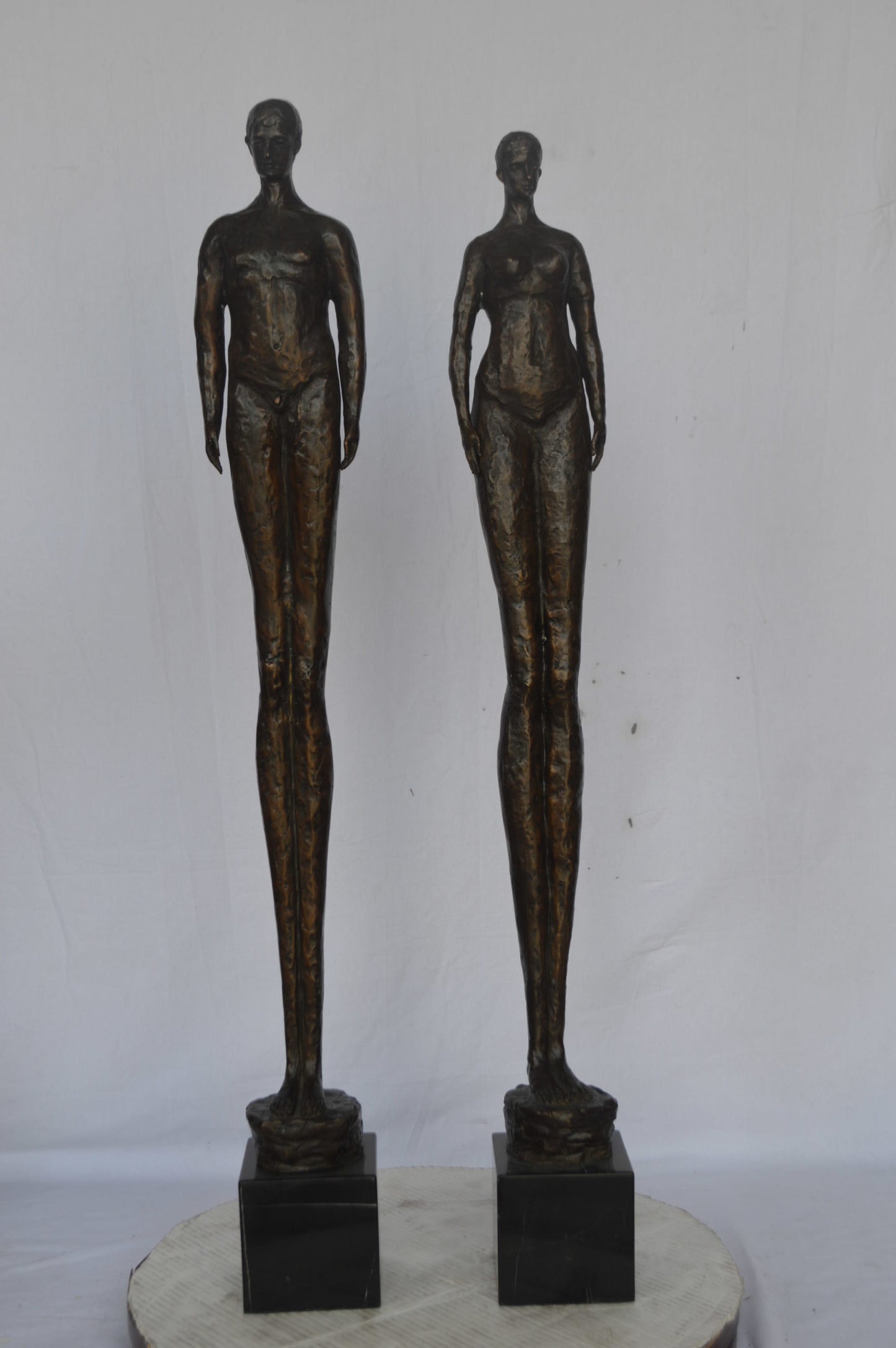 Modern art Pair, tall couple standing bronze statue - Size: 5"L x 5"W x 45"H.