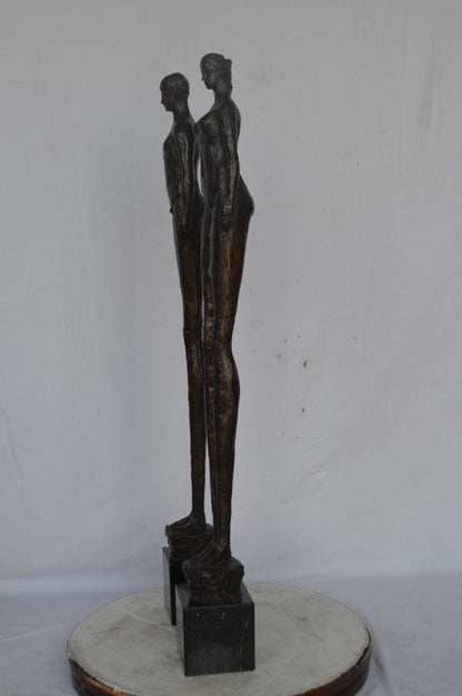 Modern art Pair, tall couple standing bronze statue - Size: 5"L x 5"W x 45"H.