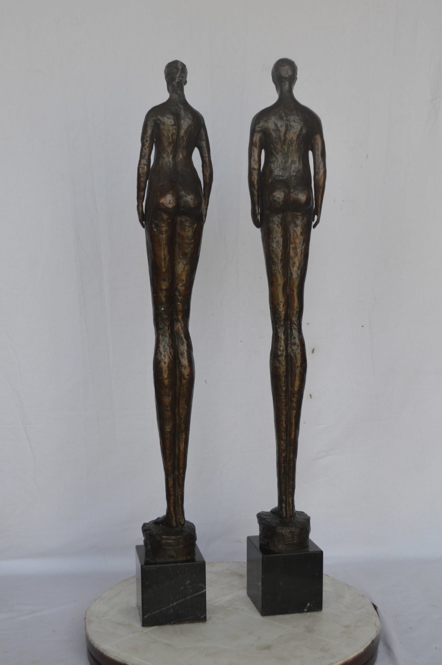 Modern art Pair, tall couple standing bronze statue - Size: 5"L x 5"W x 45"H.