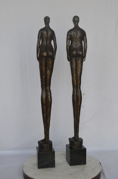 Modern art Pair, tall couple standing bronze statue - Size: 5"L x 5"W x 45"H.