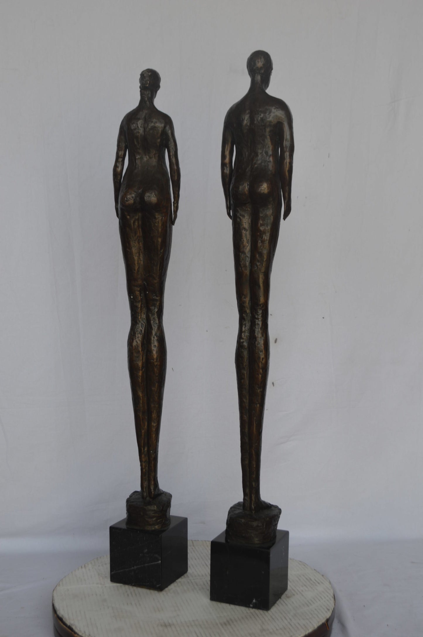Modern art Pair, tall couple standing bronze statue - Size: 5"L x 5"W x 45"H.