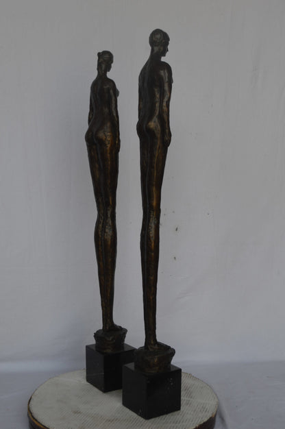 Modern art Pair, tall couple standing bronze statue - Size: 5"L x 5"W x 45"H.