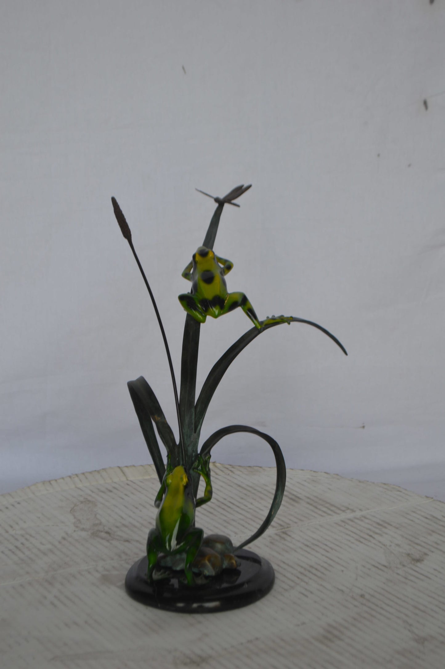 Two Green Frogs catching a dragonfly Bronze Statue - Size: 17"L x 10"W x 13"H.