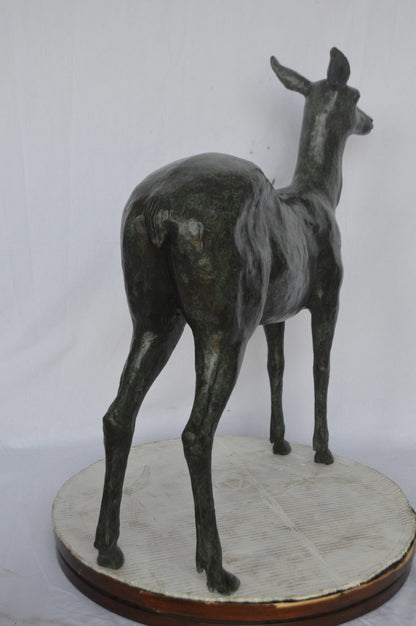 Doe - Baby Deer Green patina Bronze Statue - Size: 30"L x 8"W x 31"H.