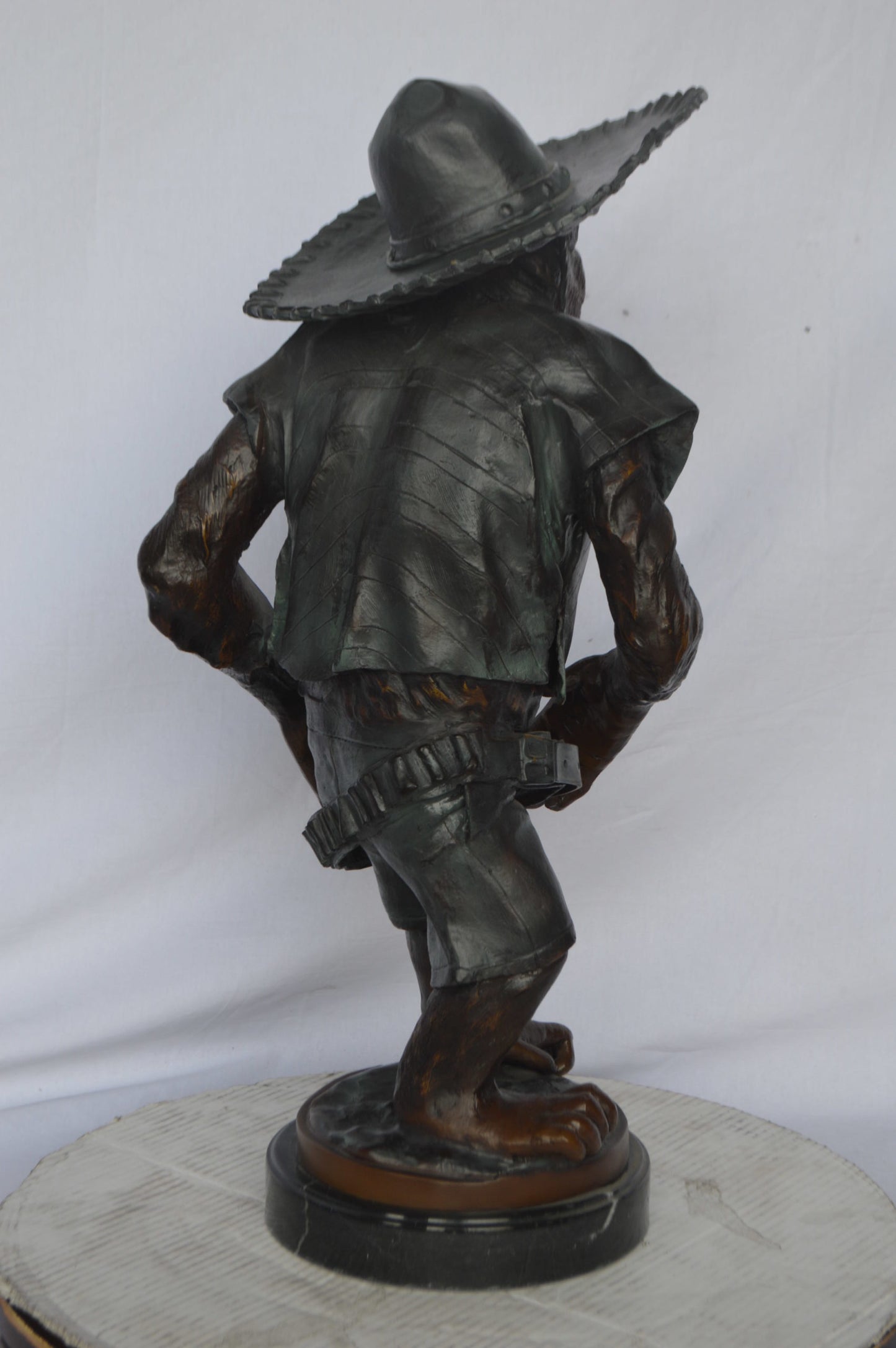 Monkey Cowboy bronze statue - Size: 14"L x 12"W x 29"H.