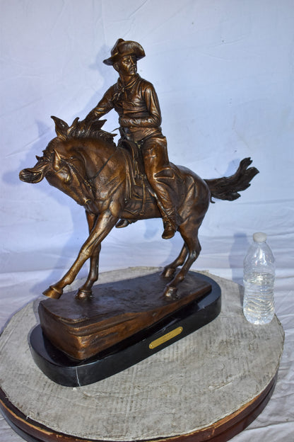 Cowboy Remington Replica Bronze Statue on Triple Marble Size: 25" x 8" x 24"H