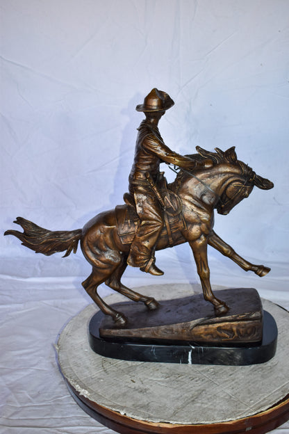 Cowboy Remington Replica Bronze Statue on Triple Marble Size: 25" x 8" x 24"H