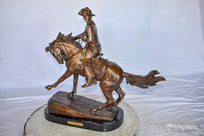 Cowboy Remington Replica Bronze Statue on Triple Marble Size: 25" x 8" x 24"H