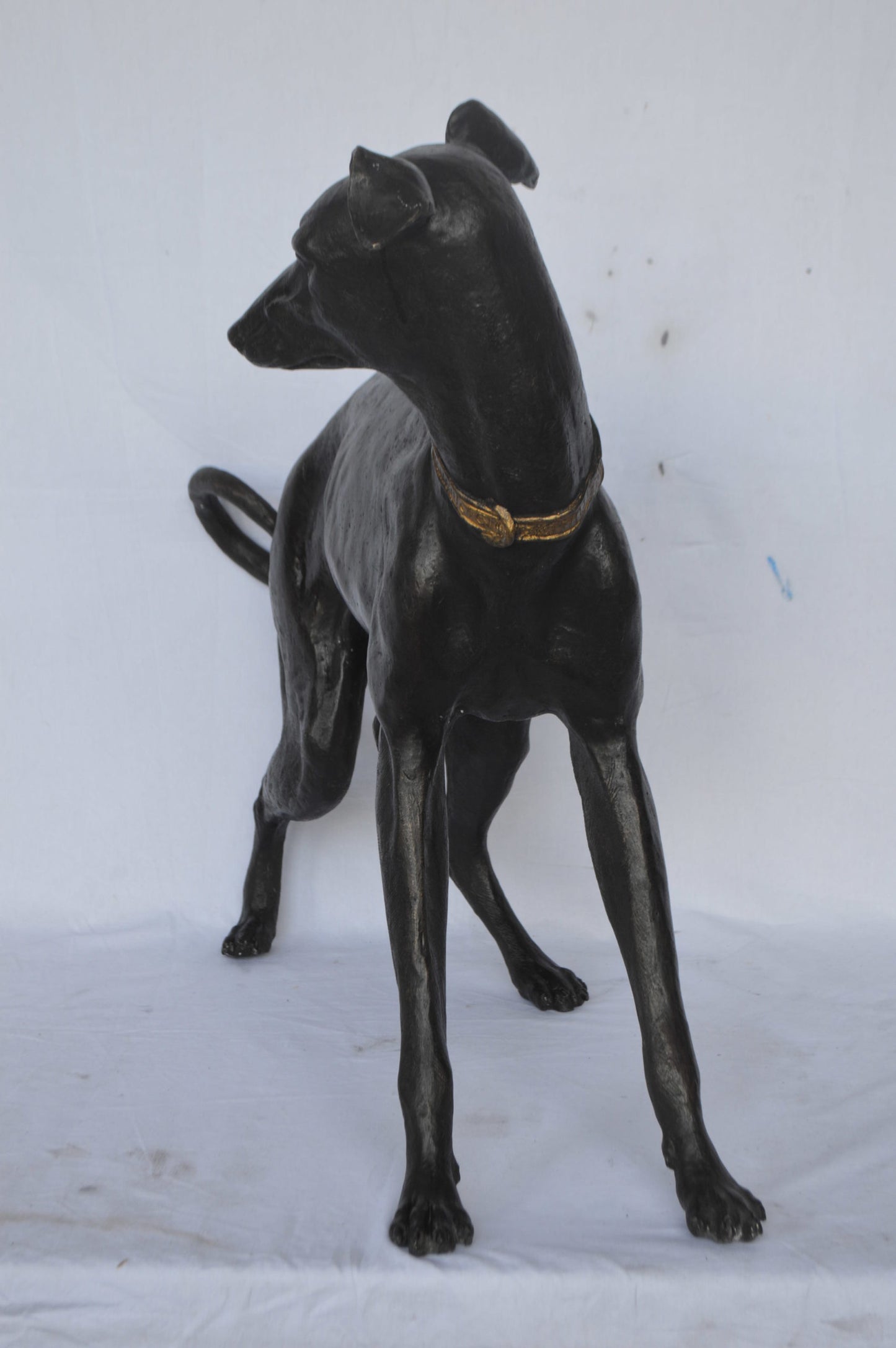 Whipped Dog bronze statue - Size: 33"L x 13"W x 30"H.