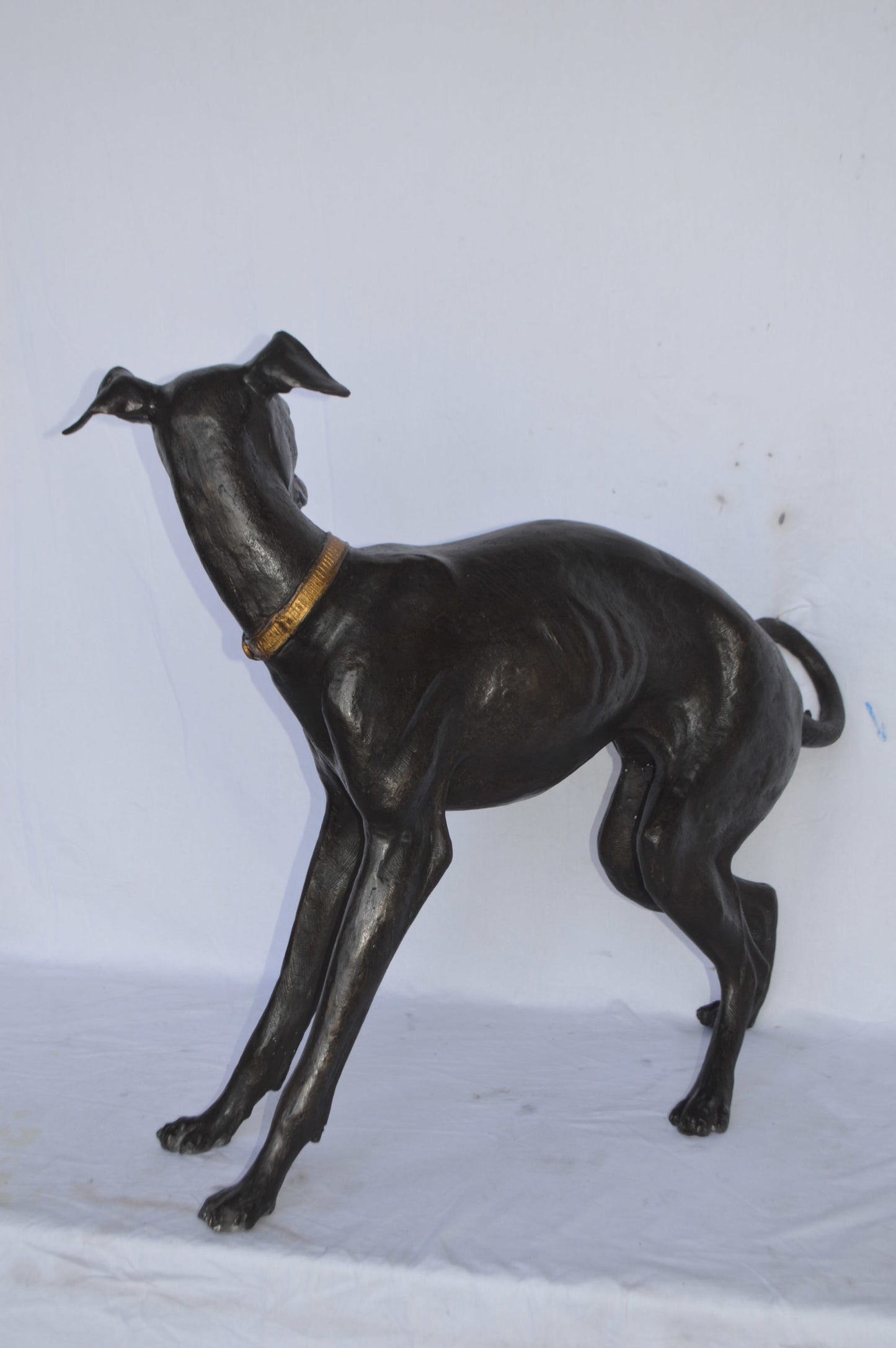 Whipped Dog bronze statue - Size: 33"L x 13"W x 30"H.
