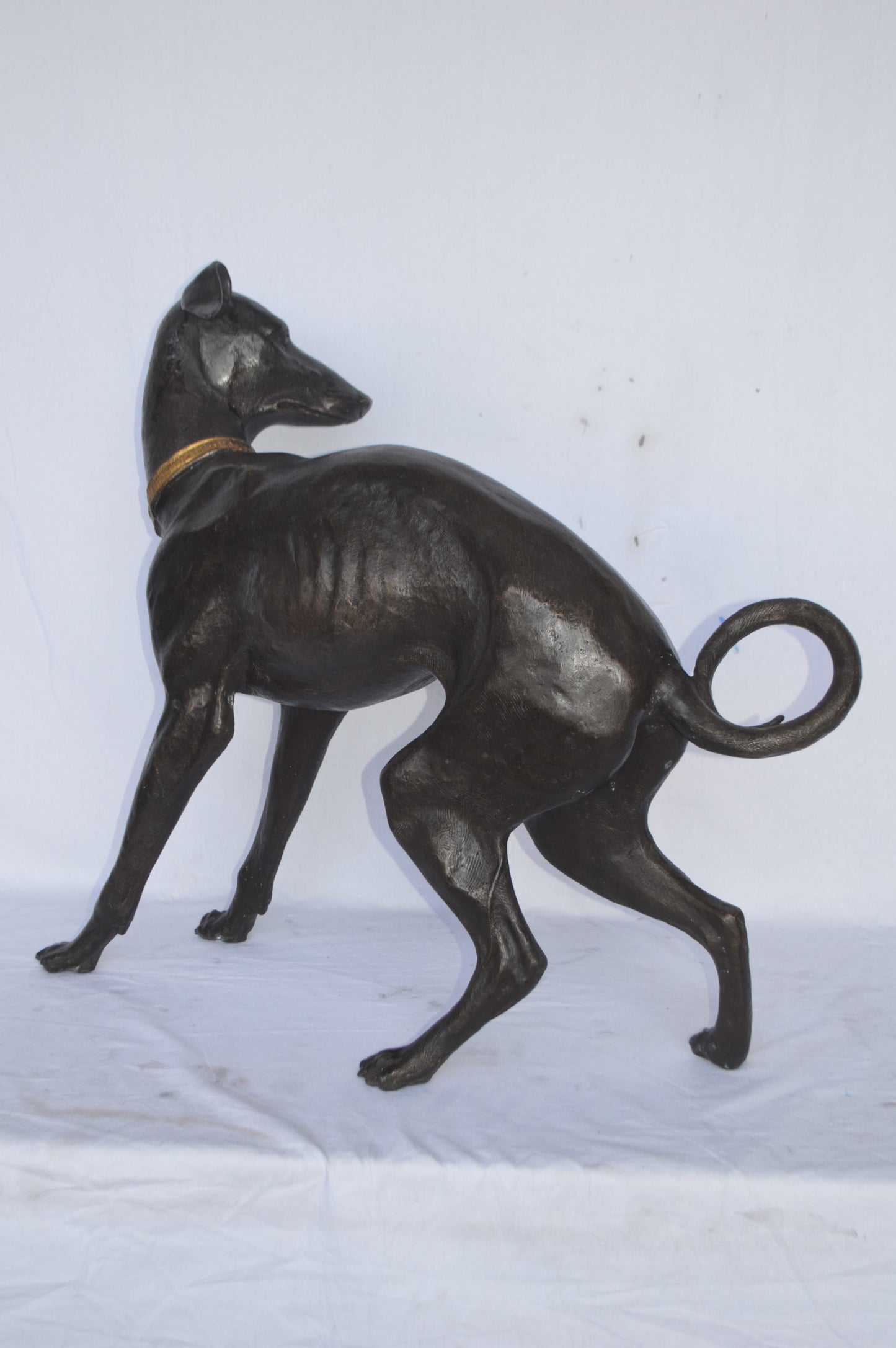 Whipped Dog bronze statue - Size: 33"L x 13"W x 30"H.