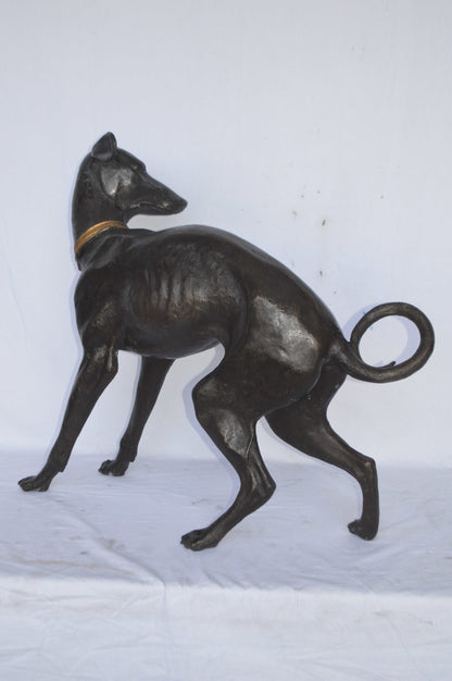 Whipped Dog bronze statue - Size: 33"L x 13"W x 30"H.