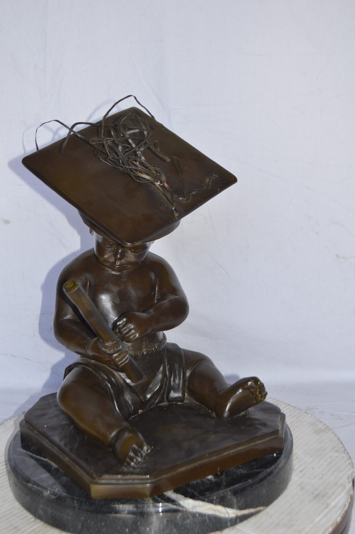 Graduating baby bronze statue -  Size: 16"L x 16"W x 21"H.