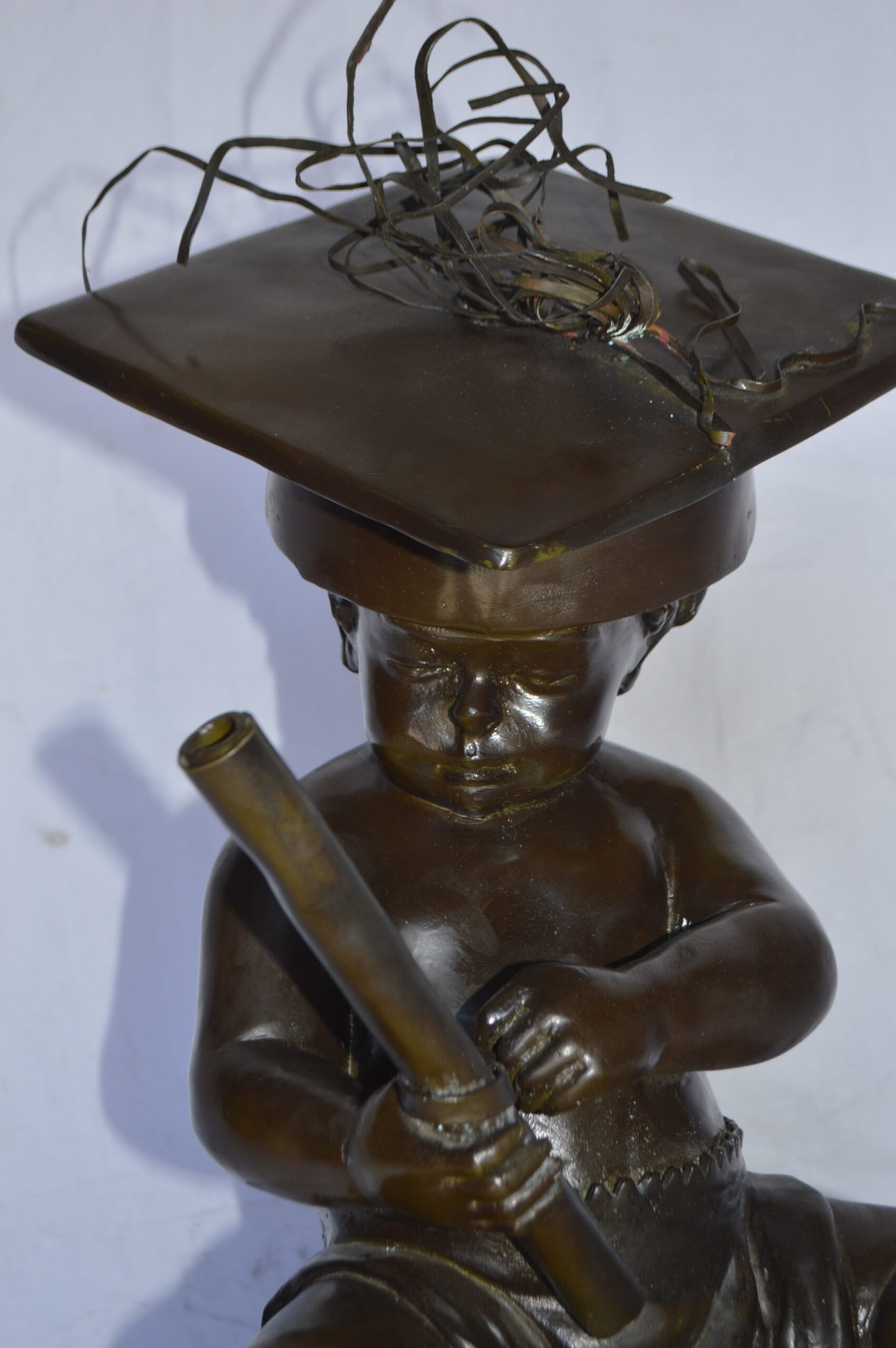 Graduating baby bronze statue -  Size: 16"L x 16"W x 21"H.