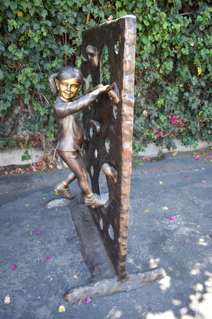 Young Girl Playing on A Climbing Wall Bronze Statue Life Size 44" x 26" x 57"H