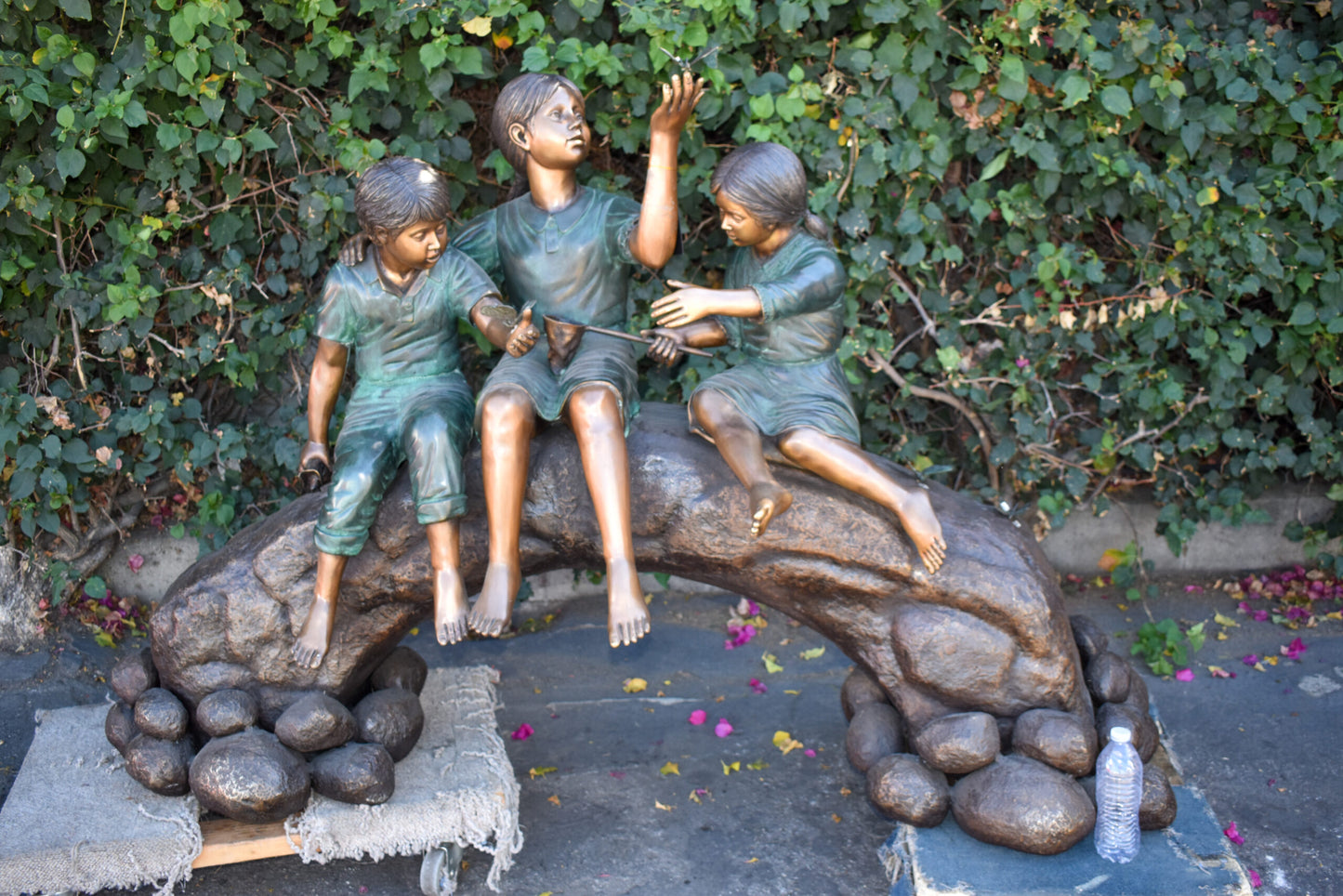 Three Kids Playing With Butterflies Bronze Statue -  Size: 70"L x 25"W x 45"H.