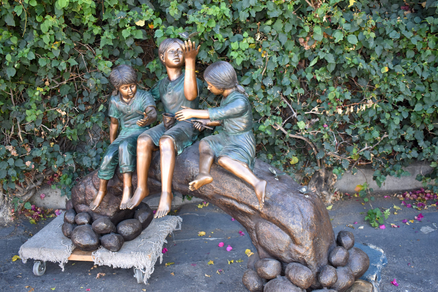 Three Kids Playing With Butterflies Bronze Statue -  Size: 70"L x 25"W x 45"H.