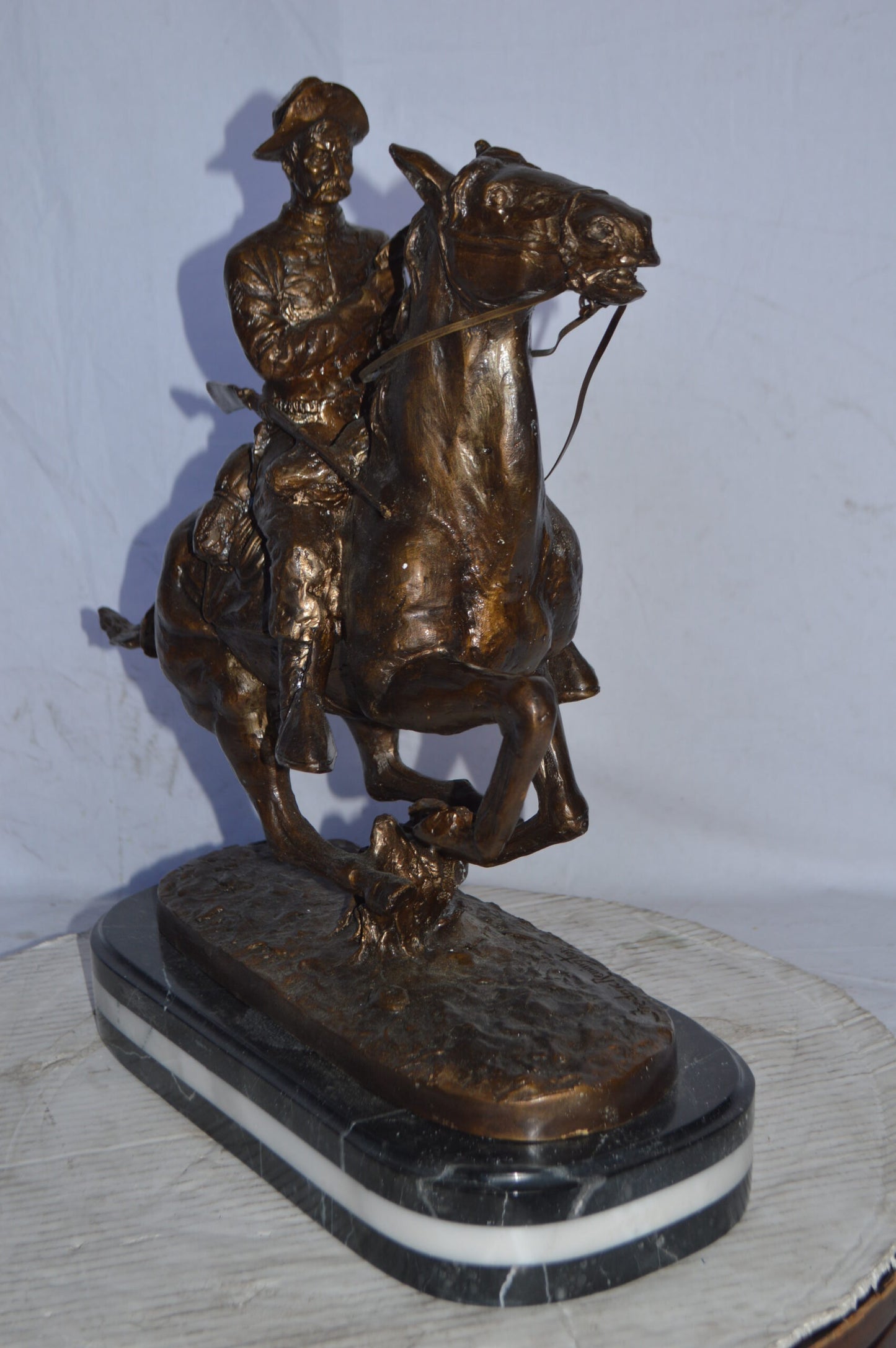 Trooper of the plains Bronze replica by Remington - Size: 20"L x 8"W x 21"H.