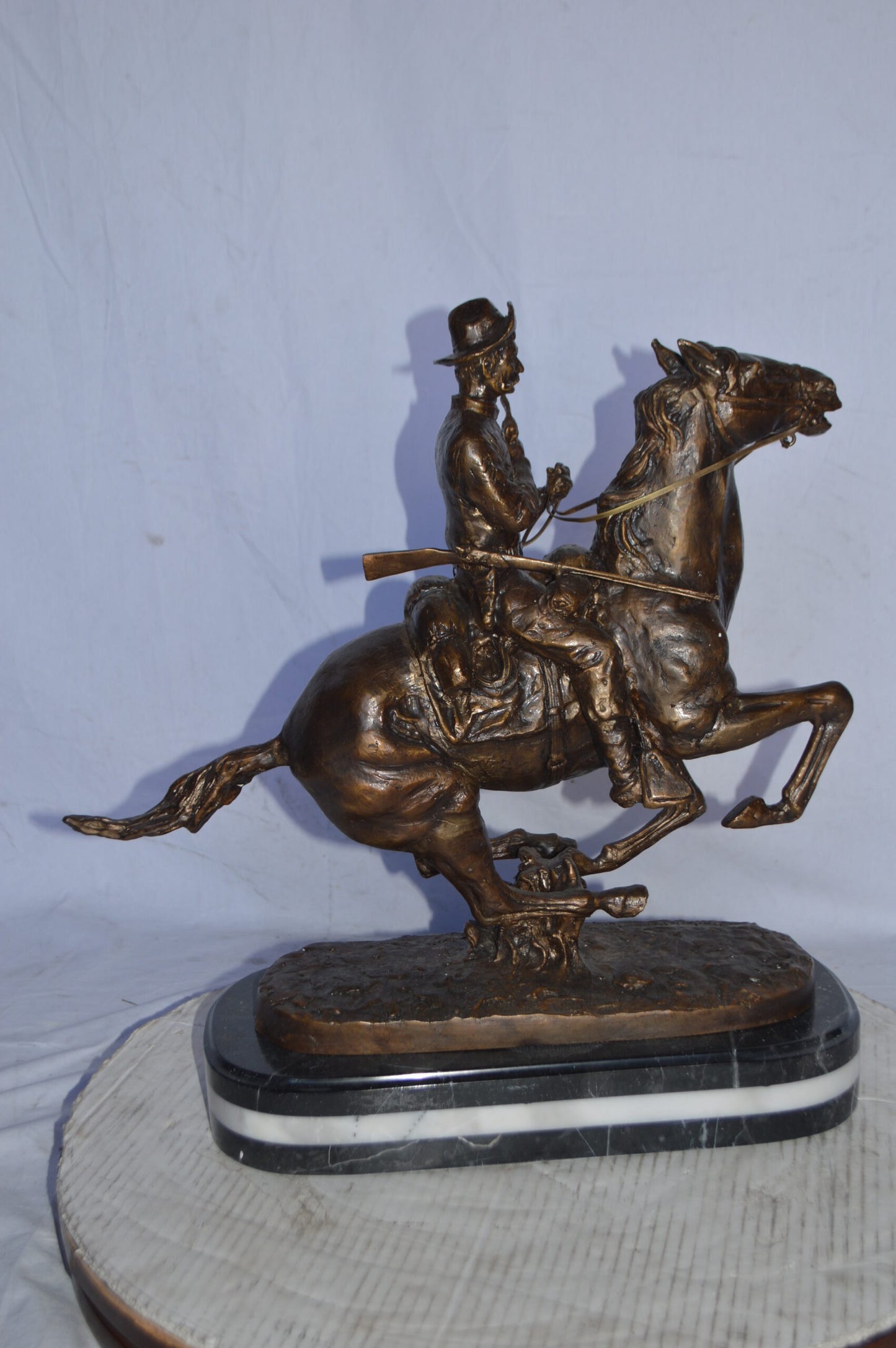 Trooper of the plains Bronze replica by Remington - Size: 20"L x 8"W x 21"H.