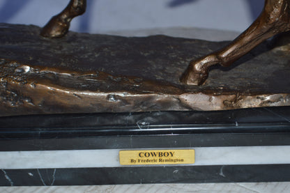 Cowboy Bronze replica by Fredric Remington - Size: 25"L x 9"W x 23"H.