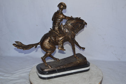 Cowboy Bronze replica by Fredric Remington - Size: 25"L x 9"W x 23"H.