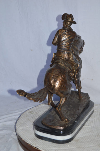 Cowboy Bronze replica by Fredric Remington - Size: 25"L x 9"W x 23"H.