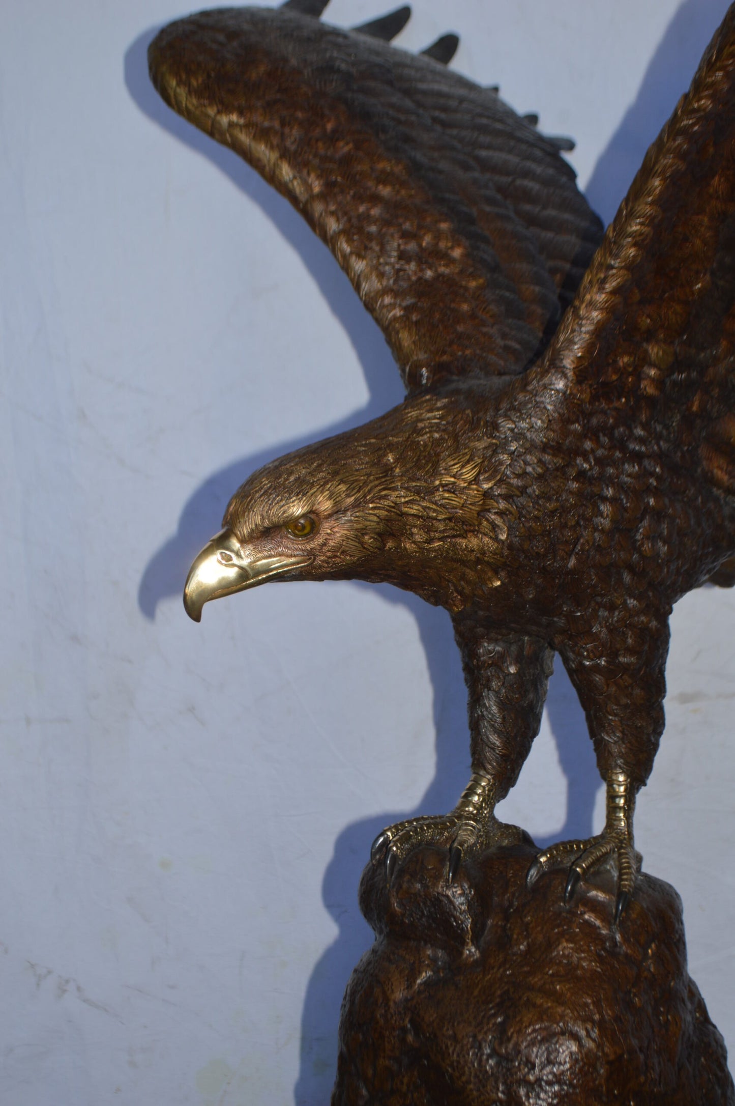 Eagle Landing on a Rock Bronze Statue - Size: 51"L x 36"W x 58"H.