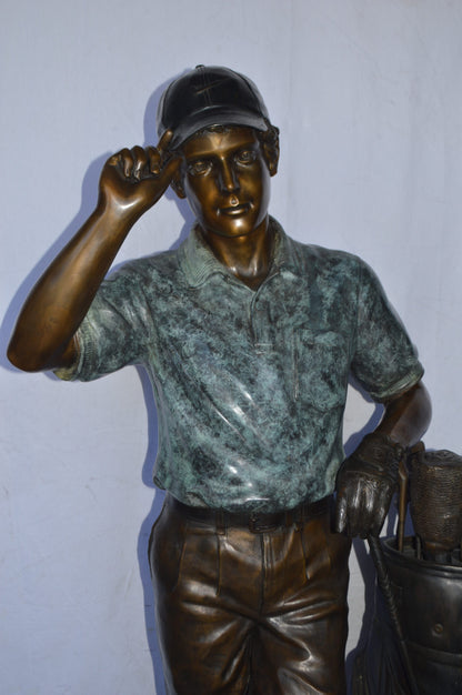 Golfer standing with his gear large bronze Statue - Size: 34"L x 21"W x 65"H.