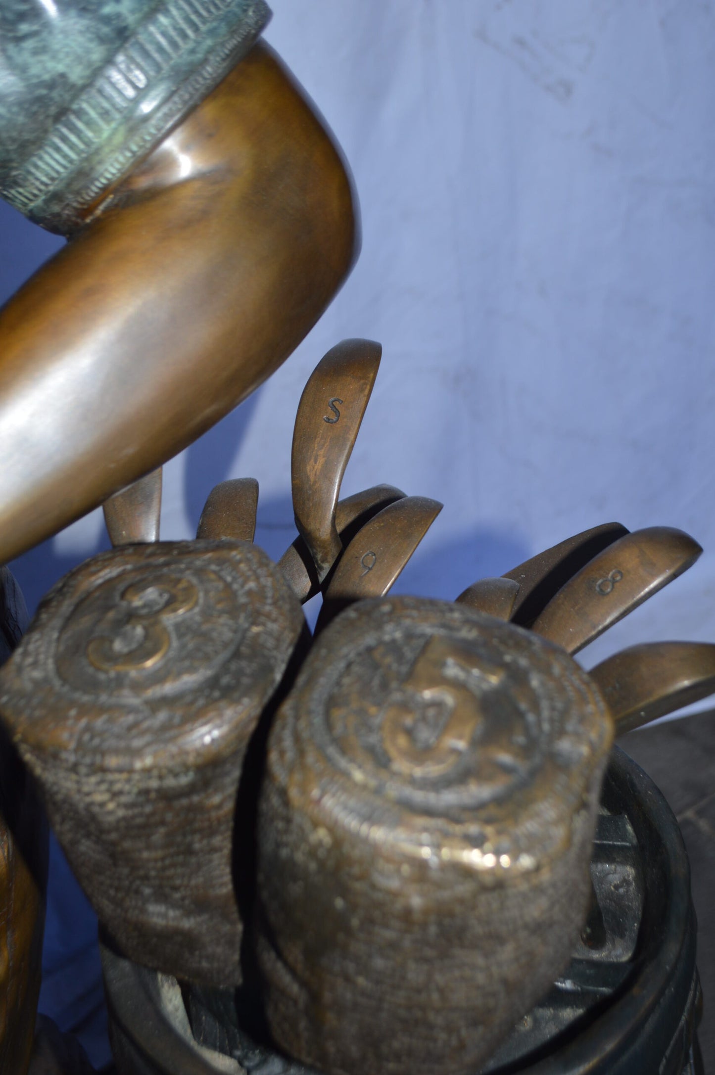 Golfer standing with his gear large bronze Statue - Size: 34"L x 21"W x 65"H.