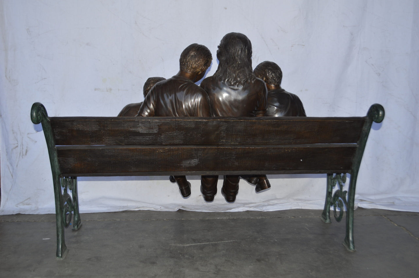 Mom and boys reading stories on bench bronze statue - Size: 53"L x 33"W x 39"H.