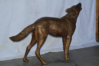 Wolf Standing and Howling Life Size Bronze Statue - Size: 45"L x 15"W x 34"H.