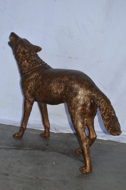 Wolf Standing and Howling Life Size Bronze Statue - Size: 45"L x 15"W x 34"H.