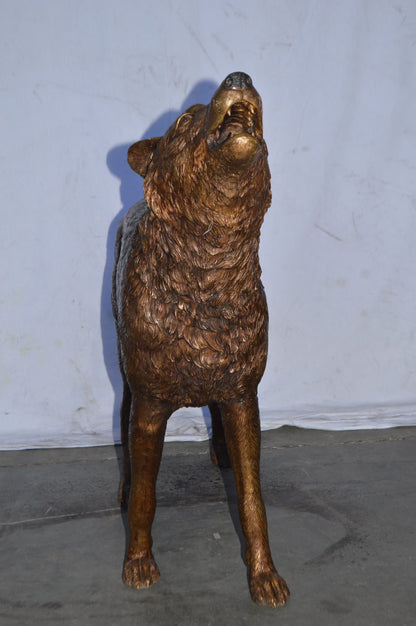 Wolf Standing and Howling Life Size Bronze Statue - Size: 45"L x 15"W x 34"H.