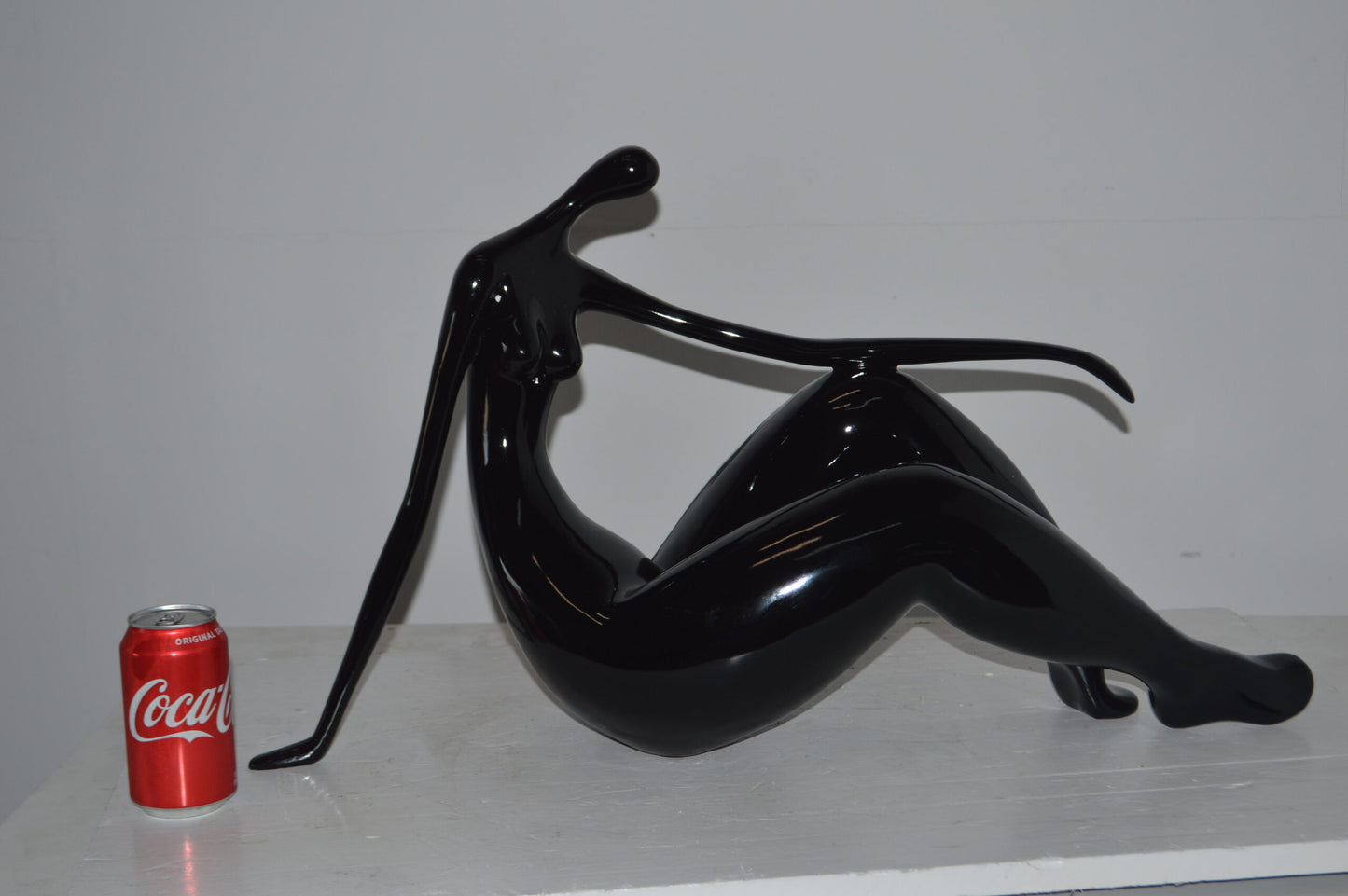 Modern Art Women on the Beach Black Resin Statue - Size: 28"L x 8"W x 16"H.