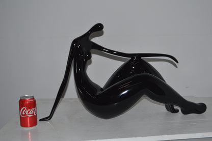 Modern Art Women on the Beach Black Resin Statue - Size: 28"L x 8"W x 16"H.