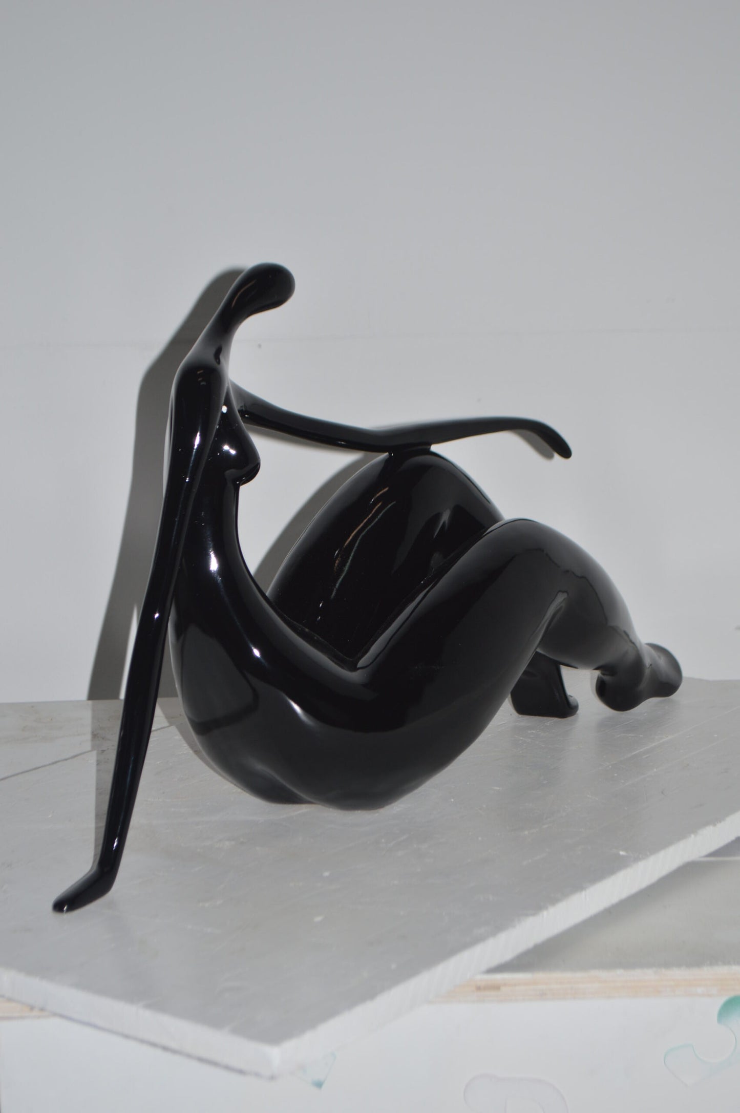 Modern Art Women on the Beach Black Resin Statue - Size: 28"L x 8"W x 16"H.