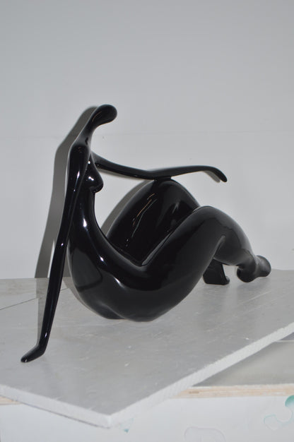 Modern Art Women on the Beach Black Resin Statue - Size: 28"L x 8"W x 16"H.