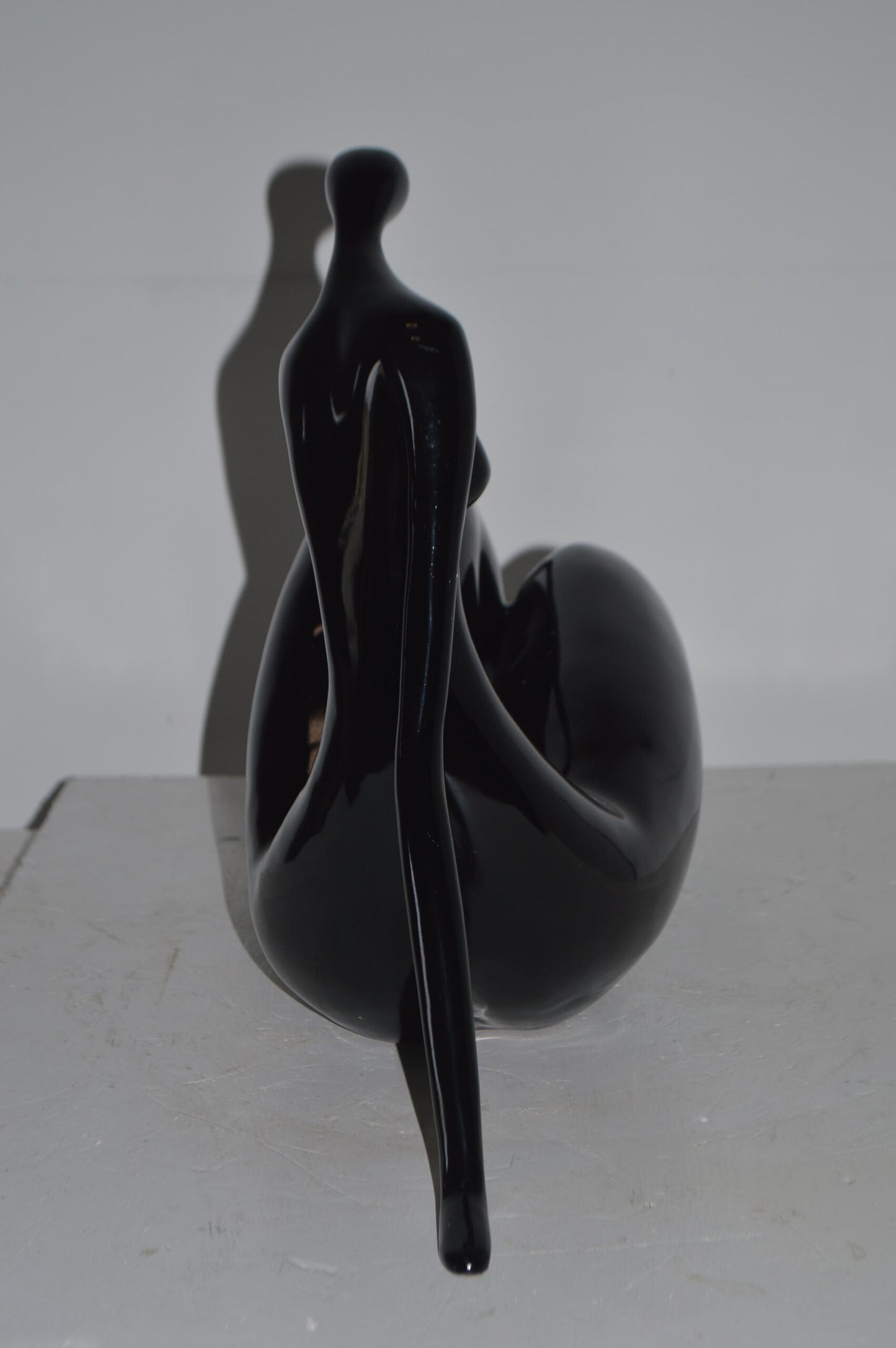 Modern Art Women on the Beach Black Resin Statue - Size: 28"L x 8"W x 16"H.