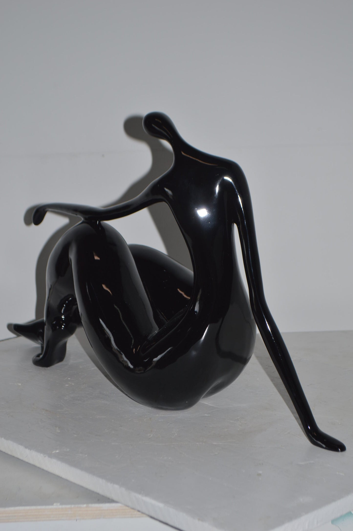Modern Art Women on the Beach Black Resin Statue - Size: 28"L x 8"W x 16"H.