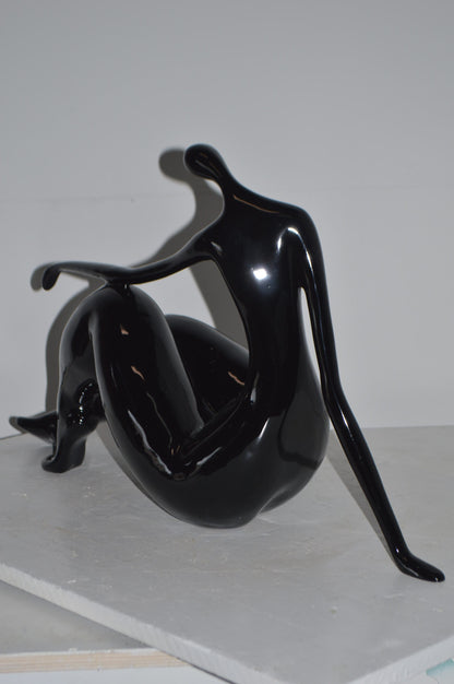Modern Art Women on the Beach Black Resin Statue - Size: 28"L x 8"W x 16"H.