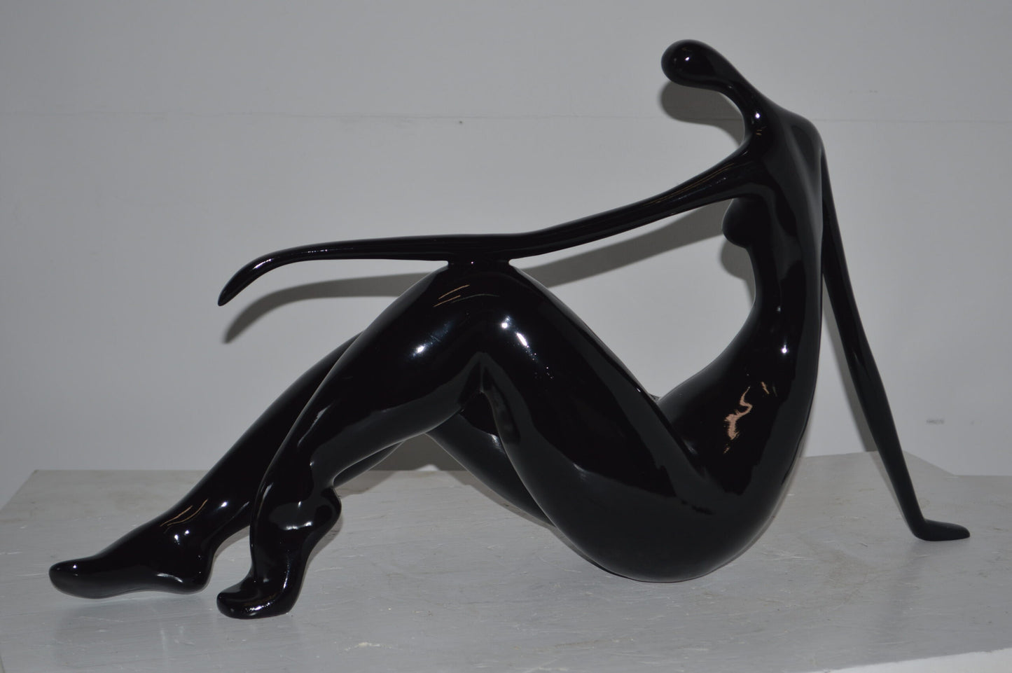 Modern Art Women on the Beach Black Resin Statue - Size: 28"L x 8"W x 16"H.