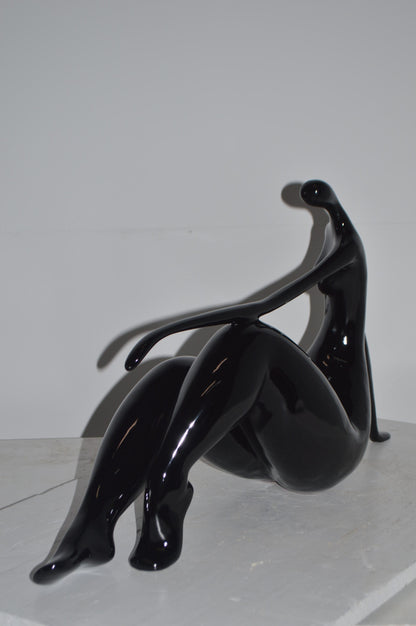 Modern Art Women on the Beach Black Resin Statue - Size: 28"L x 8"W x 16"H.