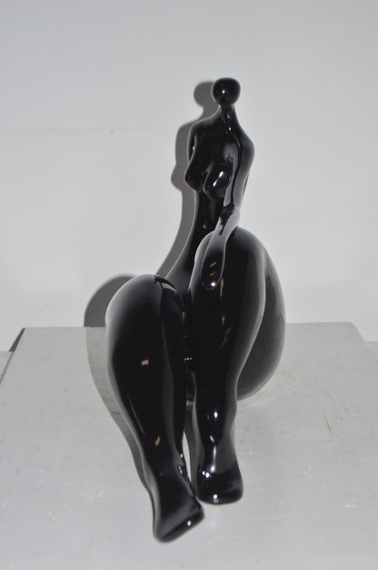Modern Art Women on the Beach Black Resin Statue - Size: 28"L x 8"W x 16"H.