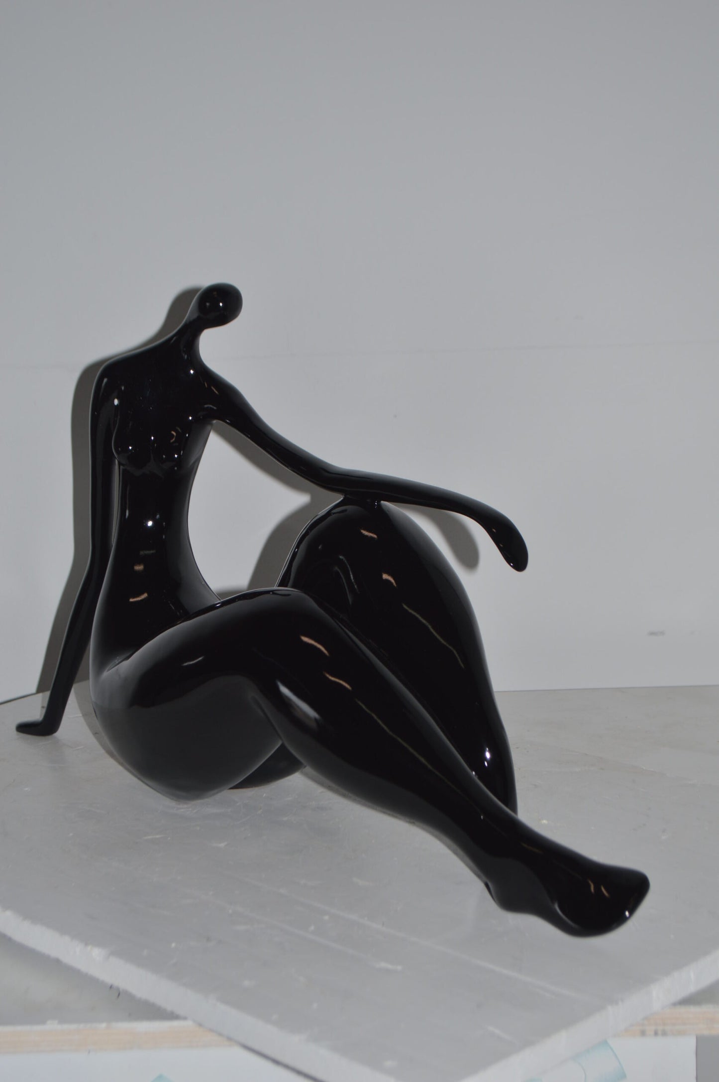 Modern Art Women on the Beach Black Resin Statue - Size: 28"L x 8"W x 16"H.