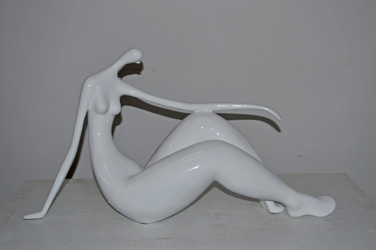 Modern Art Women on the Beach White Resin Statue - Size: 28"L x 8"W x 16"H.