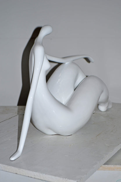 Modern Art Women on the Beach White Resin Statue - Size: 28"L x 8"W x 16"H.