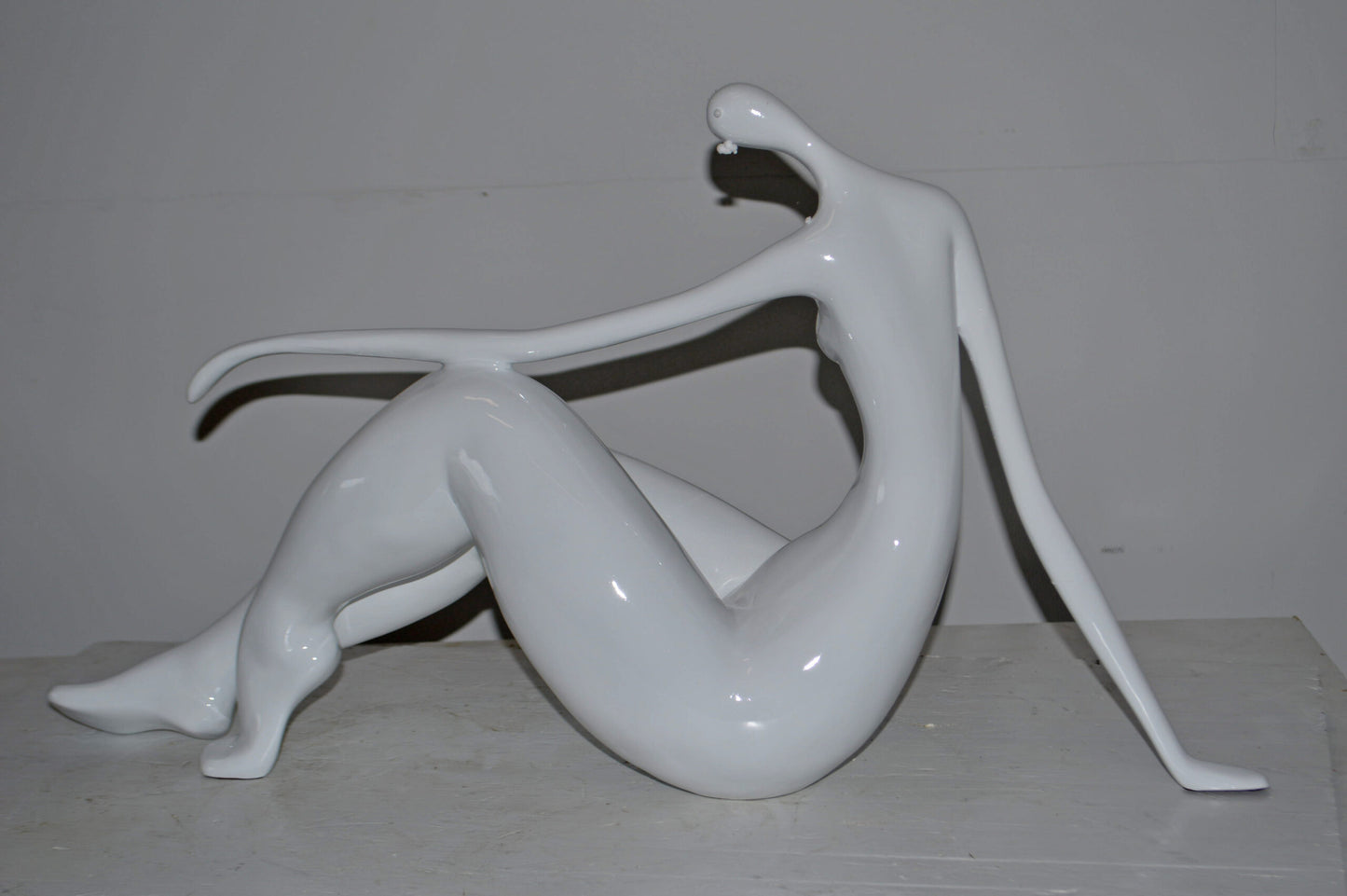 Modern Art Women on the Beach White Resin Statue - Size: 28"L x 8"W x 16"H.