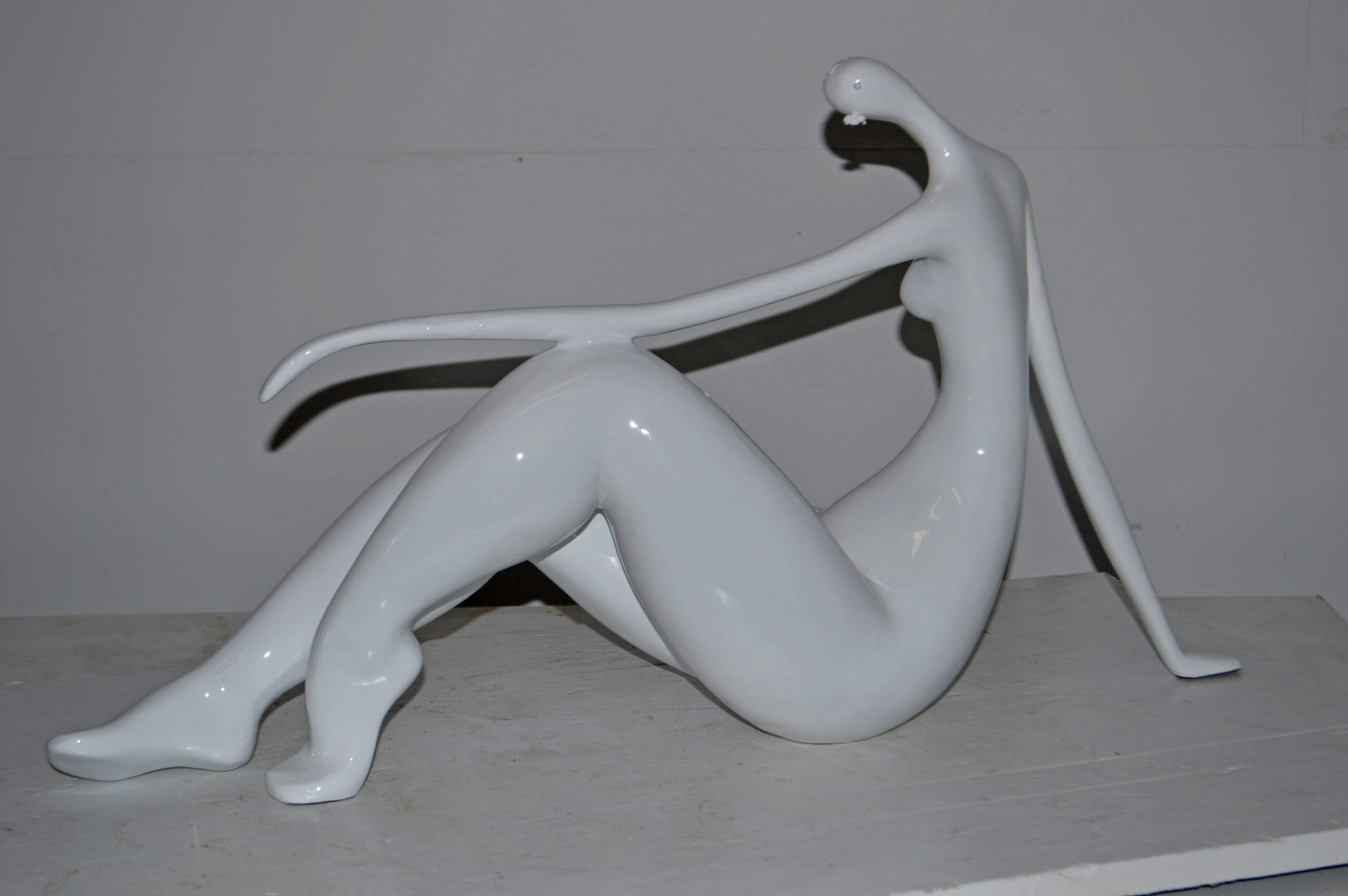 Modern Art Women on the Beach White Resin Statue - Size: 28"L x 8"W x 16"H.