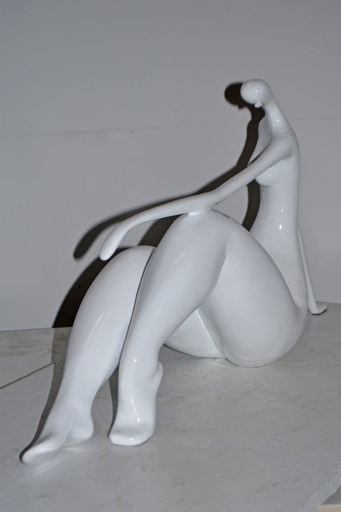 Modern Art Women on the Beach White Resin Statue - Size: 28"L x 8"W x 16"H.