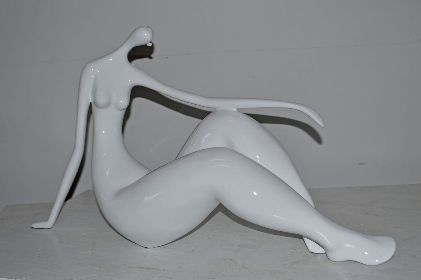 Modern Art Women on the Beach White Resin Statue - Size: 28"L x 8"W x 16"H.